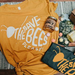 a bee-themed gift set including a t-shirt, honey and other gifts