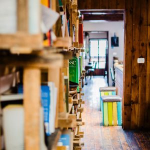 Photo of books on wooden shelves