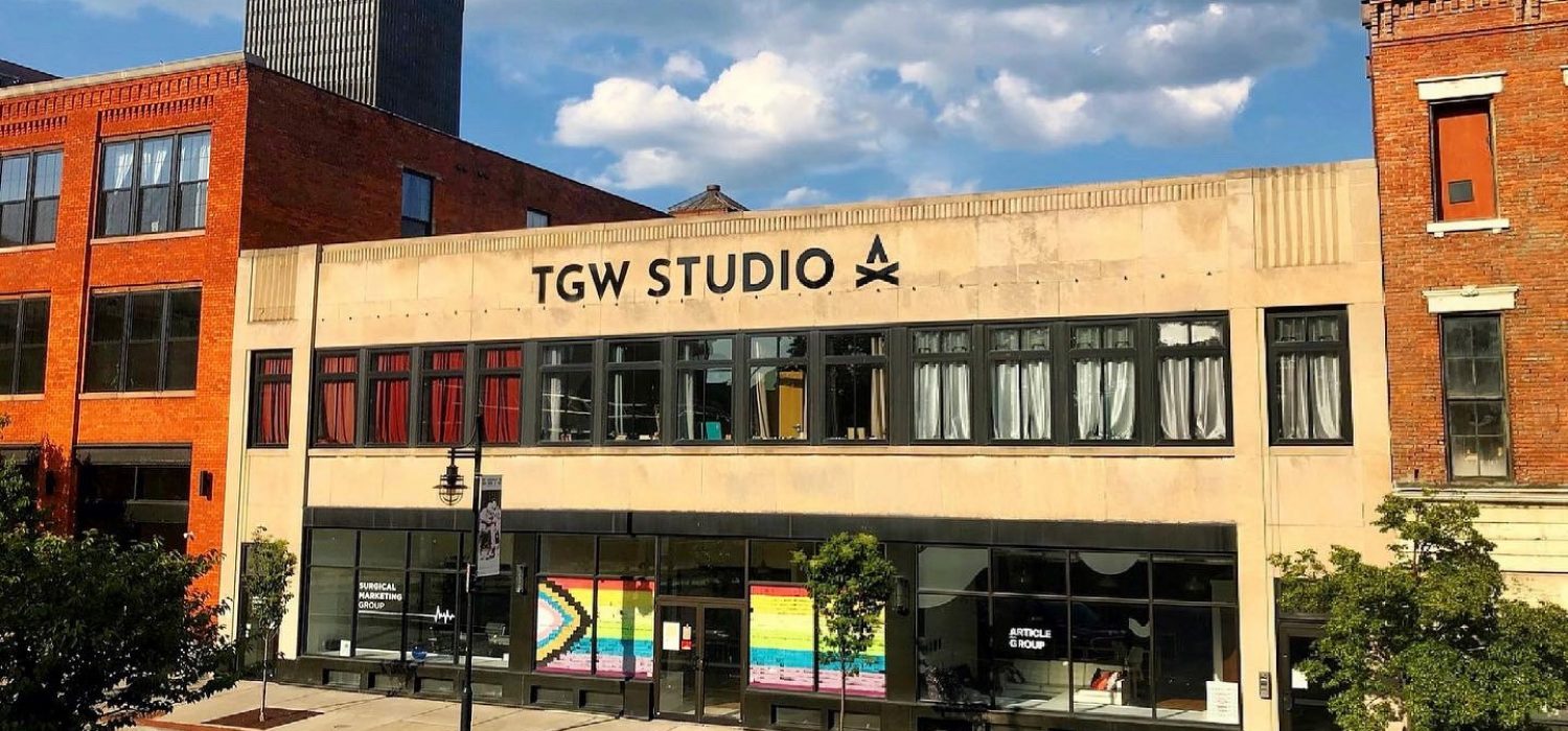 TGW Studio: its windows covered in post-it notes so they create the Inclusive Pride flag